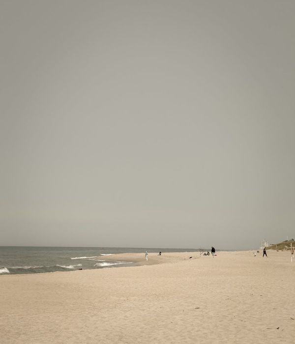 Person meditating peacefully in a bright, clean space.